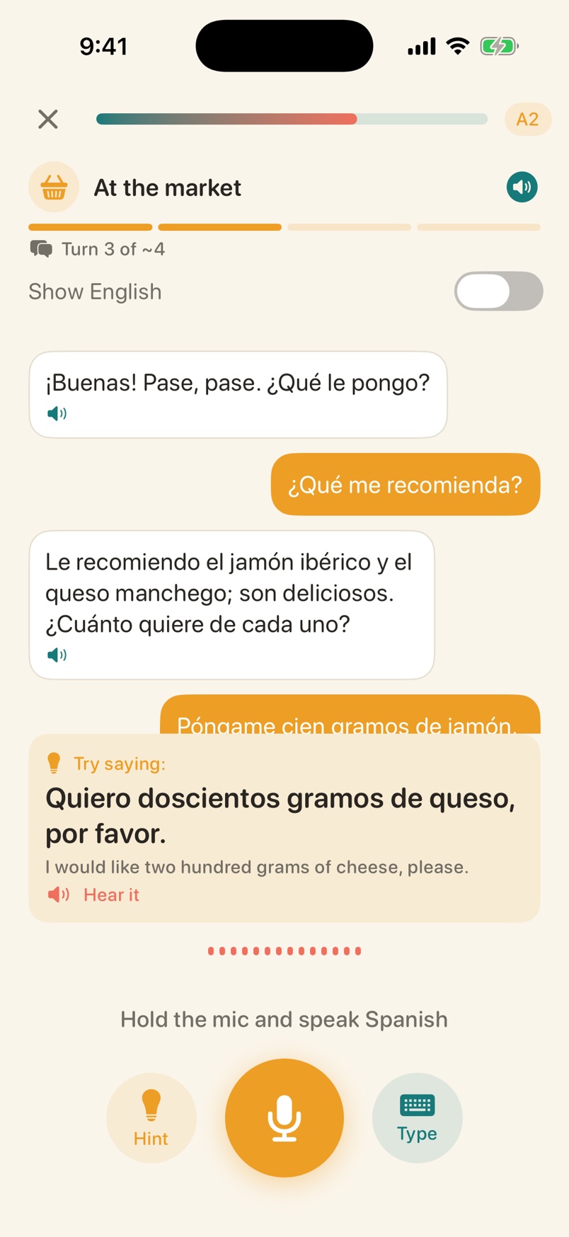 Voxolo conversation with a hint card open, suggesting Quiero doscientos gramos de queso, por favor, with the English translation and a Hear it button